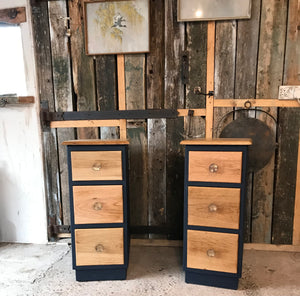 Two solid oak slimline bedside tables with drawers.