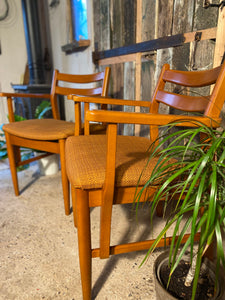 Two Meredew chairs with original upholstery.