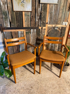 Two Meredew chairs with original upholstery.