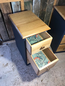 Two solid oak slimline bedside tables with drawers.